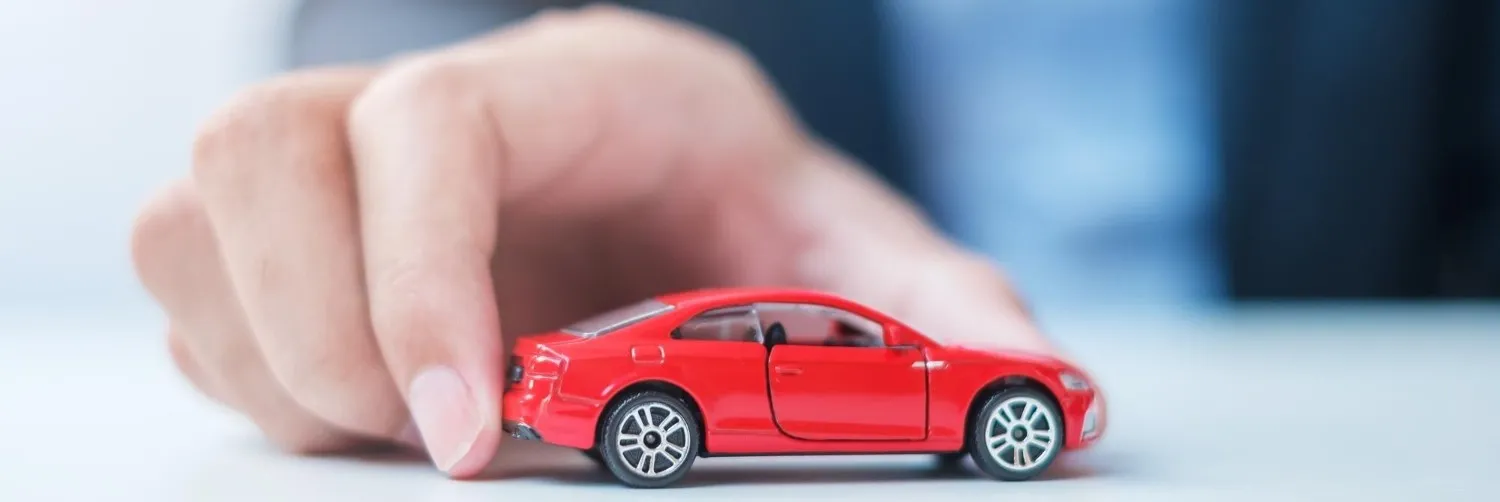 Driver discussing auto insurance coverage at a desk
